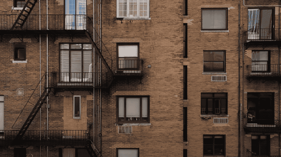 Drone view of NYC brick building façade for Local Law 11 inspection